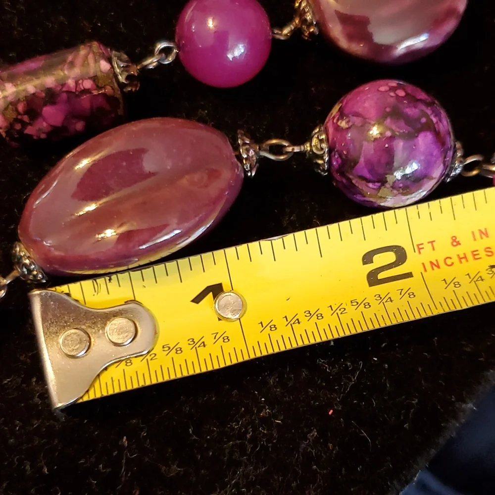Gunmetal double strand necklace with purple seed bead bows and marble look beads